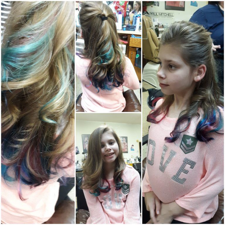 A young client with playful blue, teal and pink color streaks at Bruce's Cut & Curl